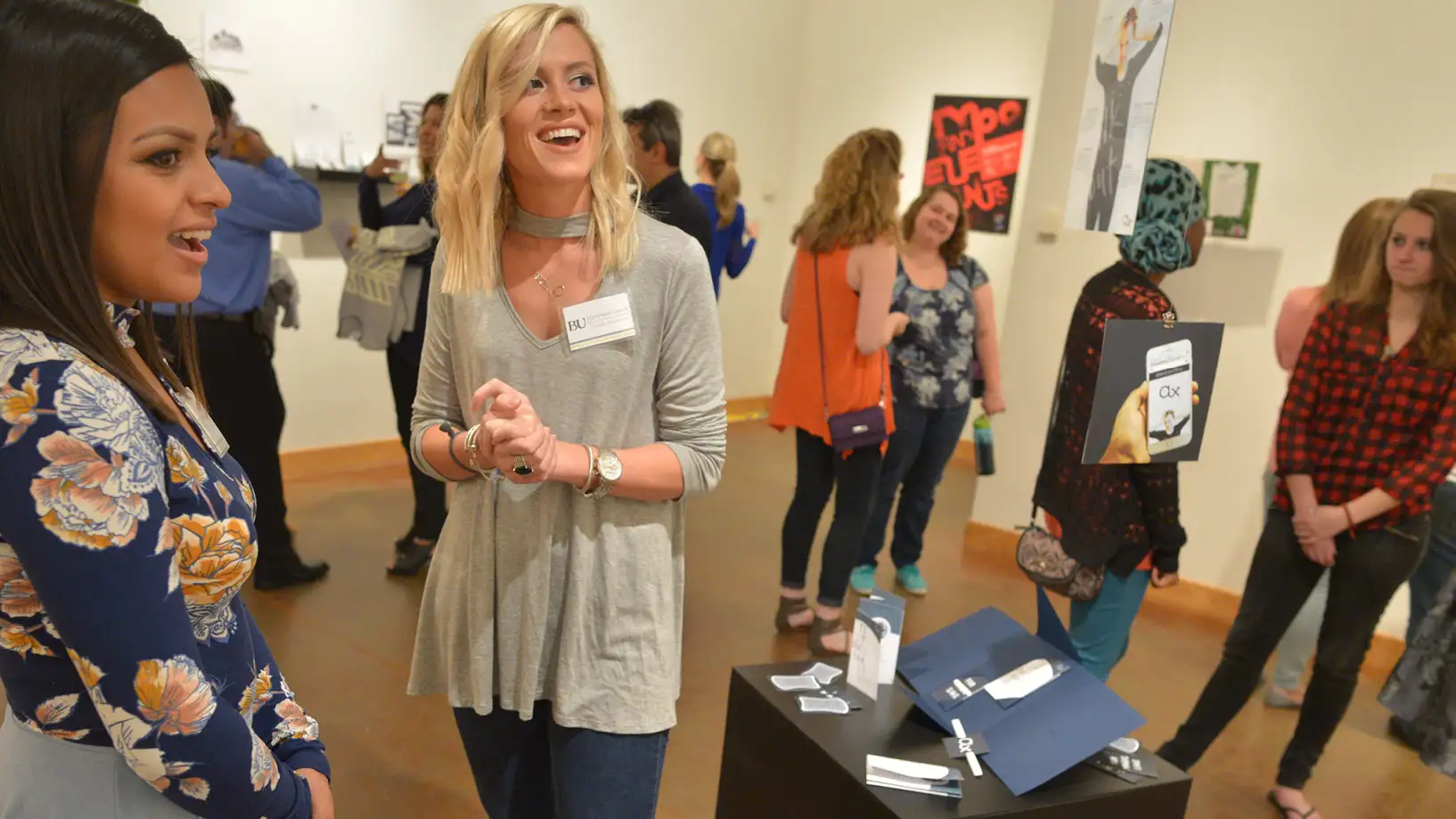people gathered at an art exhibit